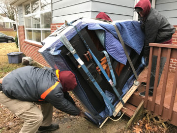 Moving the piano down the stairs