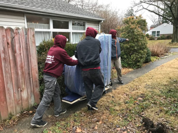 Moving the piano to the moving truck