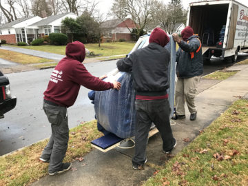 Moving the piano to the moving truck