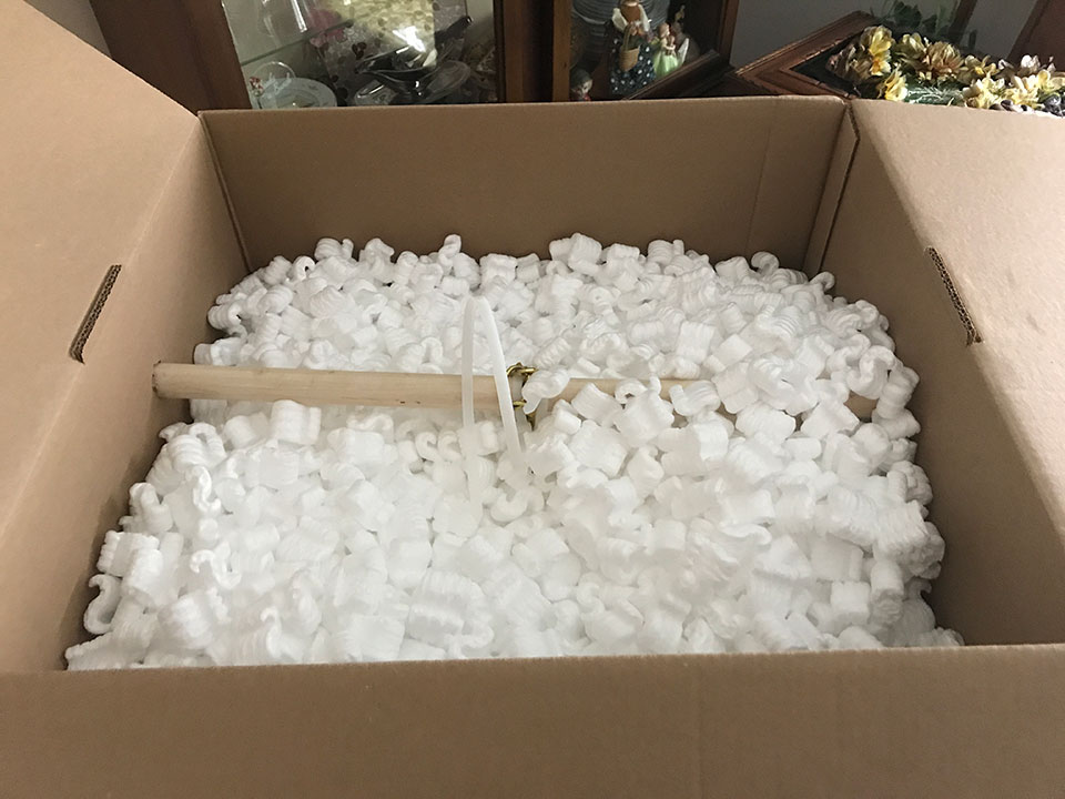 Then our team fills the box with styrofoam packing to keep it safe!