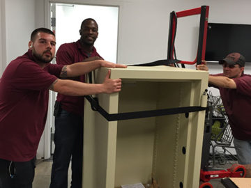 Our team gets the safe ready to be moved throughout the halls of its new home.