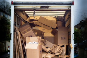 disorganized moving boxes in moving truck
