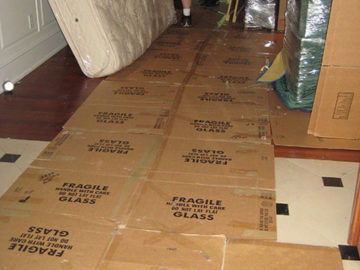 On move day, you will have a lot of people shuffling in and out the front door! We lay down boxes to ensure our movers don't carry dirt inside your home.