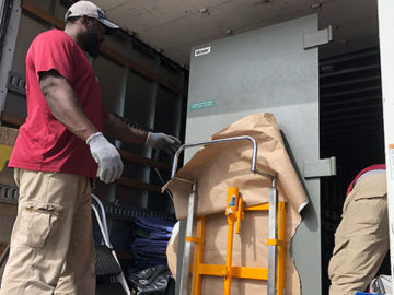 We safely secure the vault door into the truck with straps to ensure there are no surprises during transit.