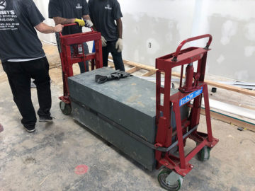 Our guys strap the safe into a dolly system in order to carefully migrate it to the moving truck.