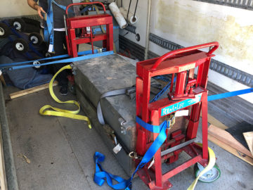 Once the safe is onto our truck, we harness it in to ensure it remains in place during the ride.