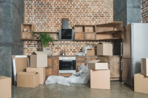 Home with plastic and boxes on the floor