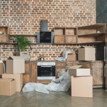 Home with plastic and boxes on the floor